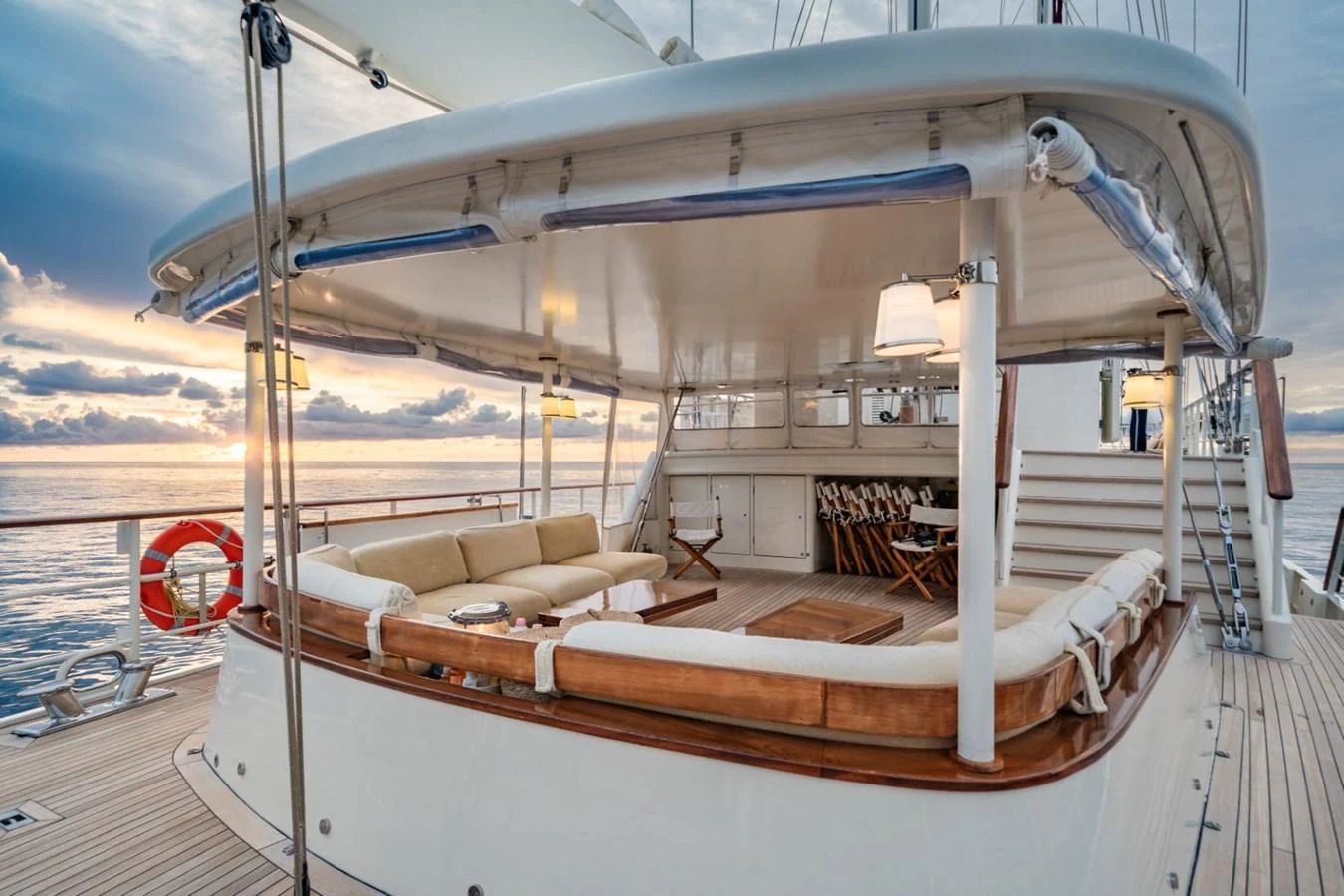The aft deck features a spacious seating area with elegant furnishings, perfect for relaxing and enjoying the ocean views. aboard DIONE STAR Yacht for Sale