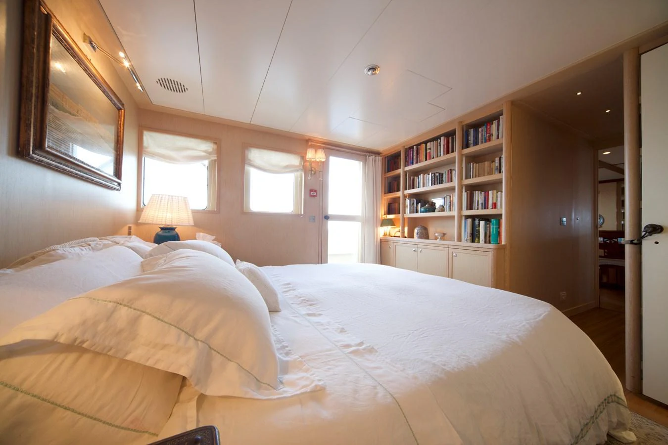 A cozy stateroom featuring a comfortable bed, soft lighting, and ample storage space. aboard DIONE STAR Yacht for Sale