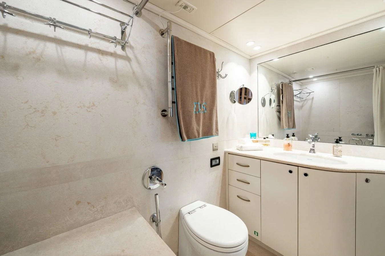 A well-appointed yacht bathroom with modern fixtures and ample storage. aboard DIONE STAR Yacht for Sale