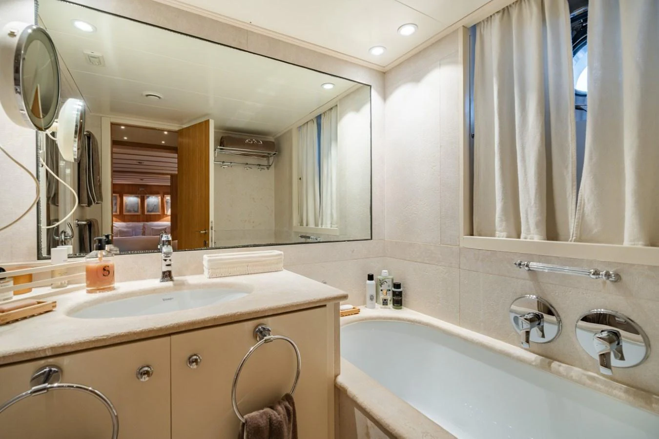 The yacht's bathroom features a luxurious bathtub and elegant fixtures. aboard DIONE STAR Yacht for Sale
