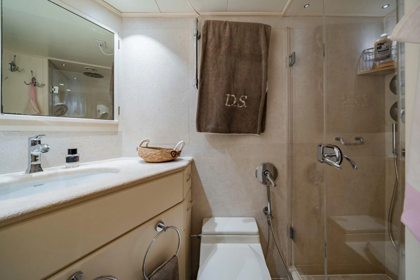 The yacht's bathroom features a sleek design with modern fixtures and a glass-enclosed shower. aboard DIONE STAR Yacht for Sale