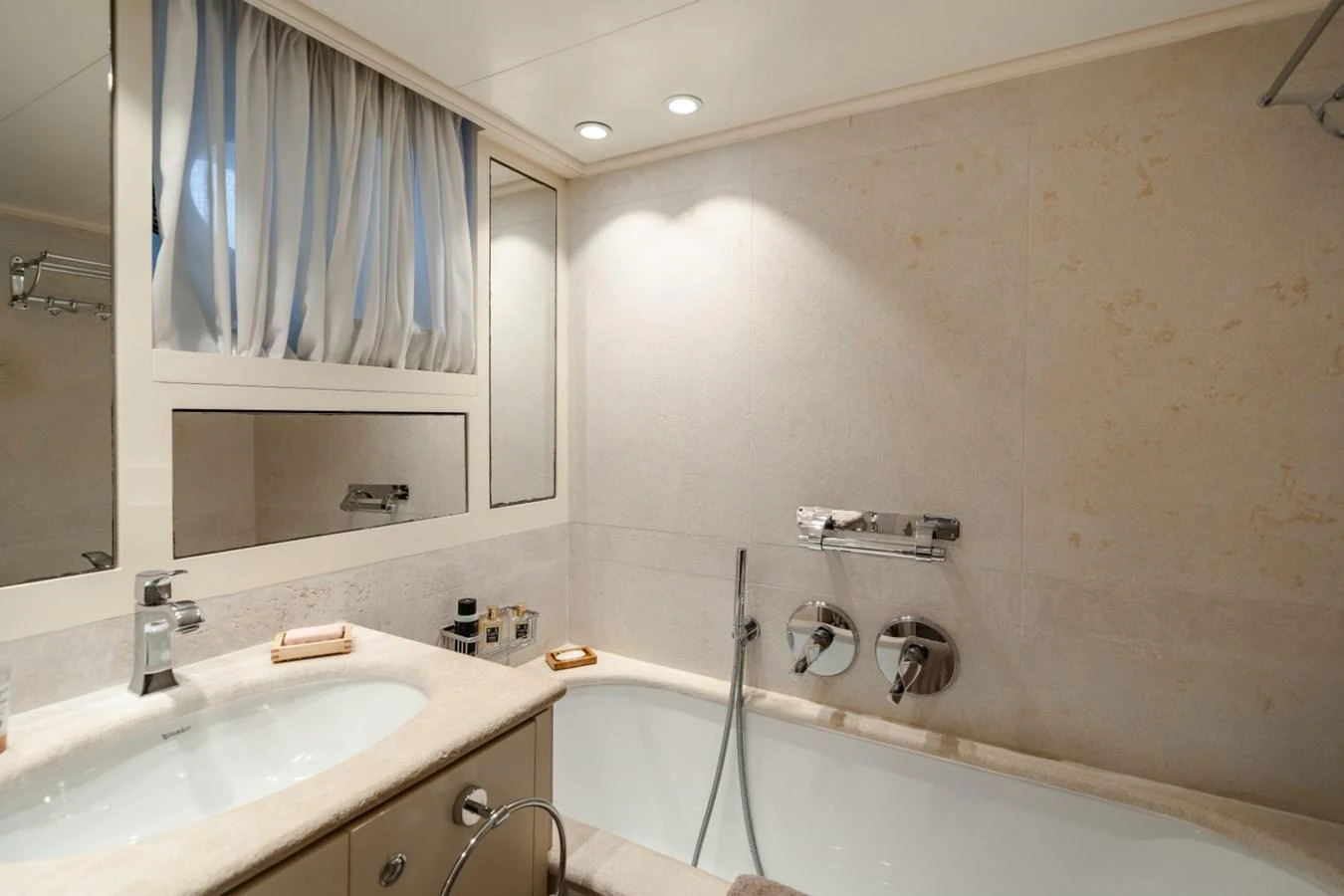 The yacht's bathroom features a luxurious bathtub and modern fixtures. aboard DIONE STAR Yacht for Sale