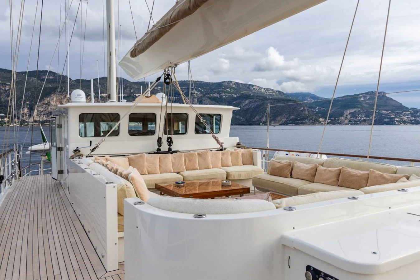 The aft deck features a spacious seating area with plush cushions, perfect for relaxation and socializing while enjoying the scenic views. aboard DIONE STAR Yacht for Sale