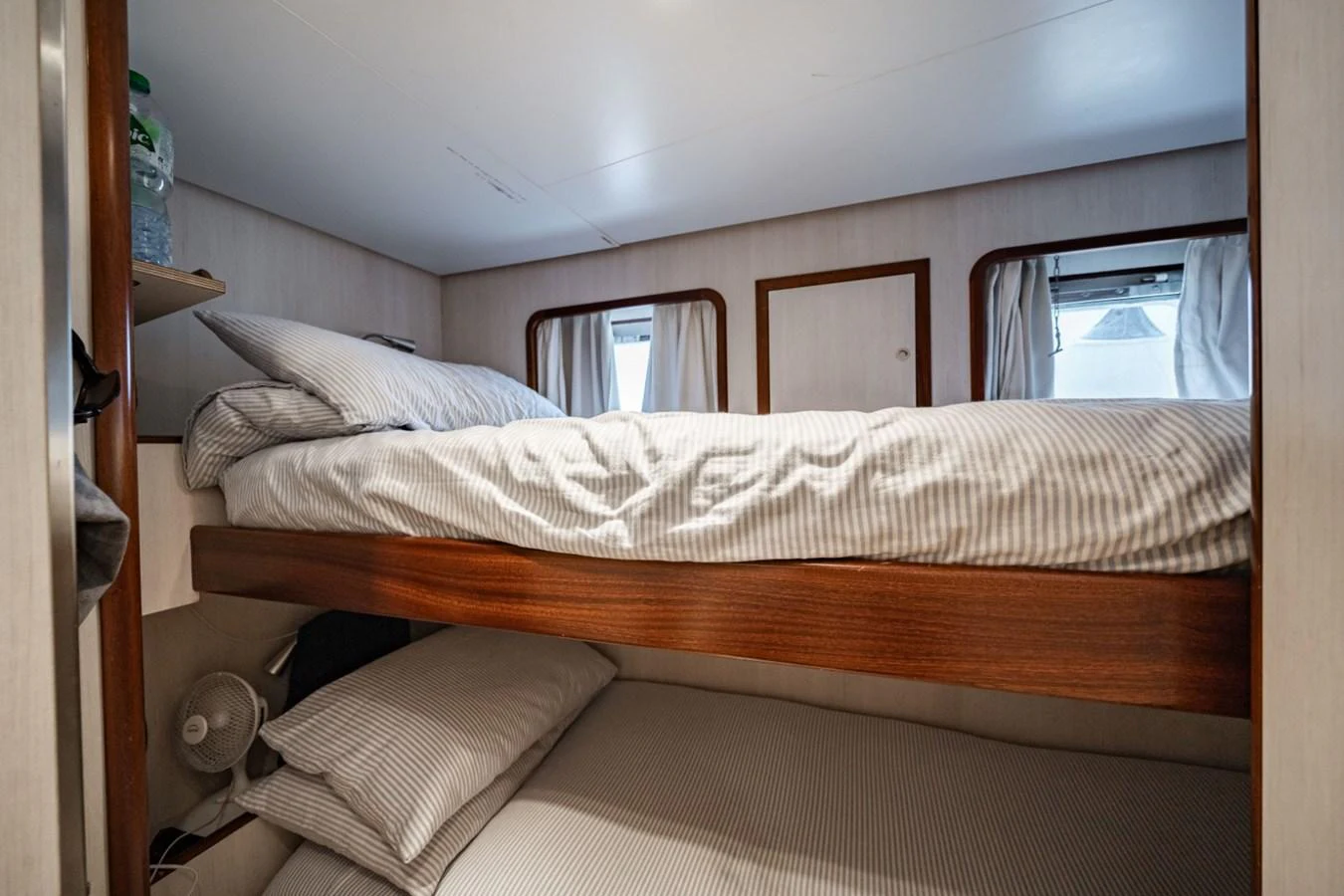 The cozy guest cabin features comfortable bunk beds and a serene atmosphere. aboard DIONE STAR Yacht for Sale