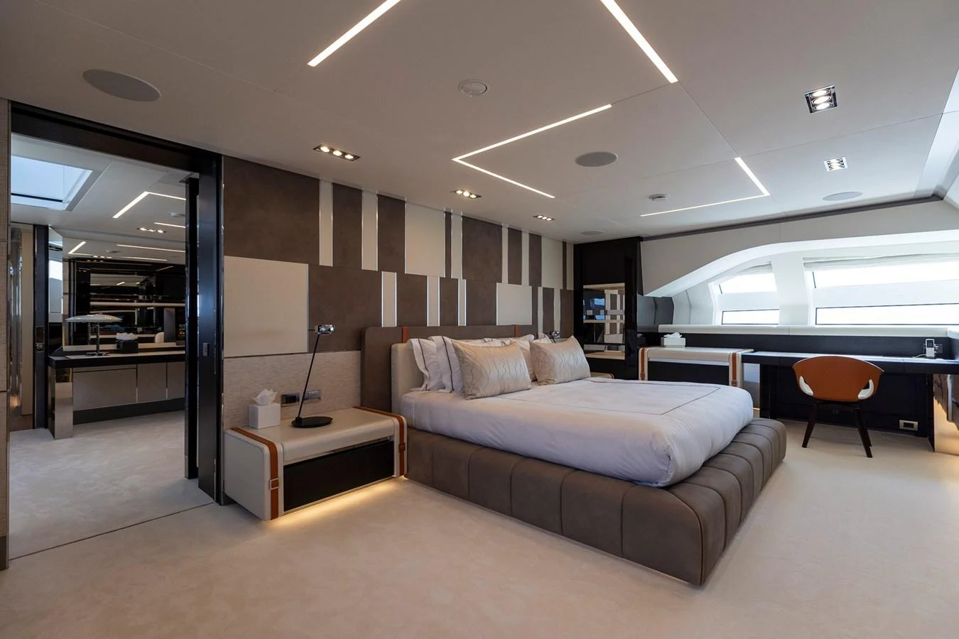 The master stateroom features a luxurious bed and modern decor with ample natural light. aboard PERSHING 140 Yacht for Sale