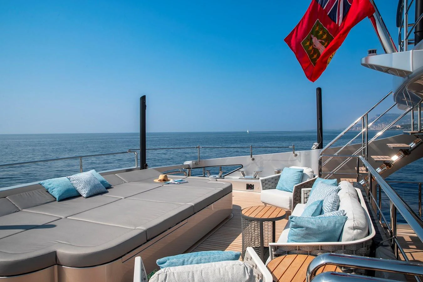 The sundeck offers a relaxing space with comfortable seating and stunning ocean views. aboard PERSHING 140 Yacht for Sale