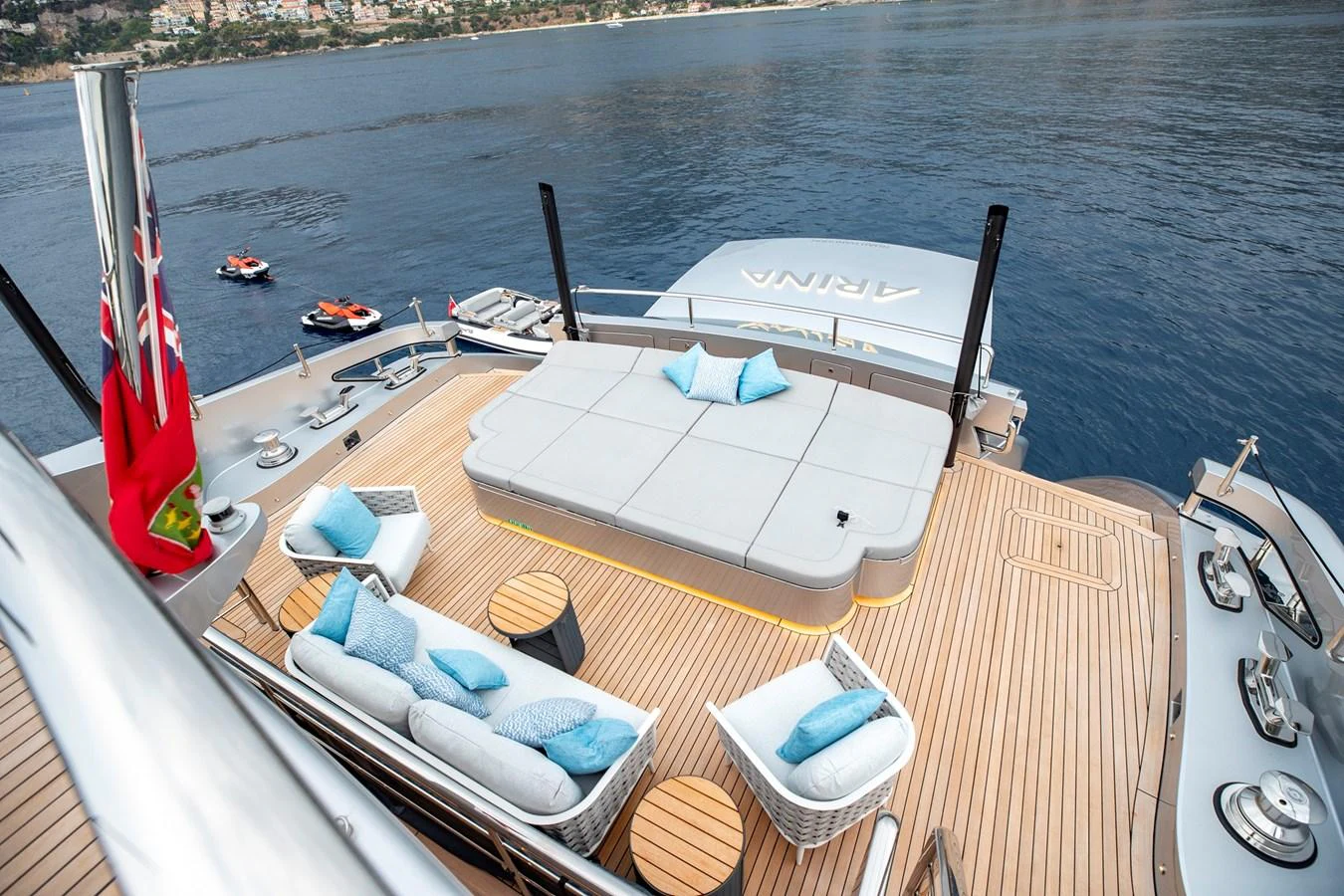 The aft deck features a spacious lounging area with comfortable seating and scenic ocean views. aboard PERSHING 140 Yacht for Sale