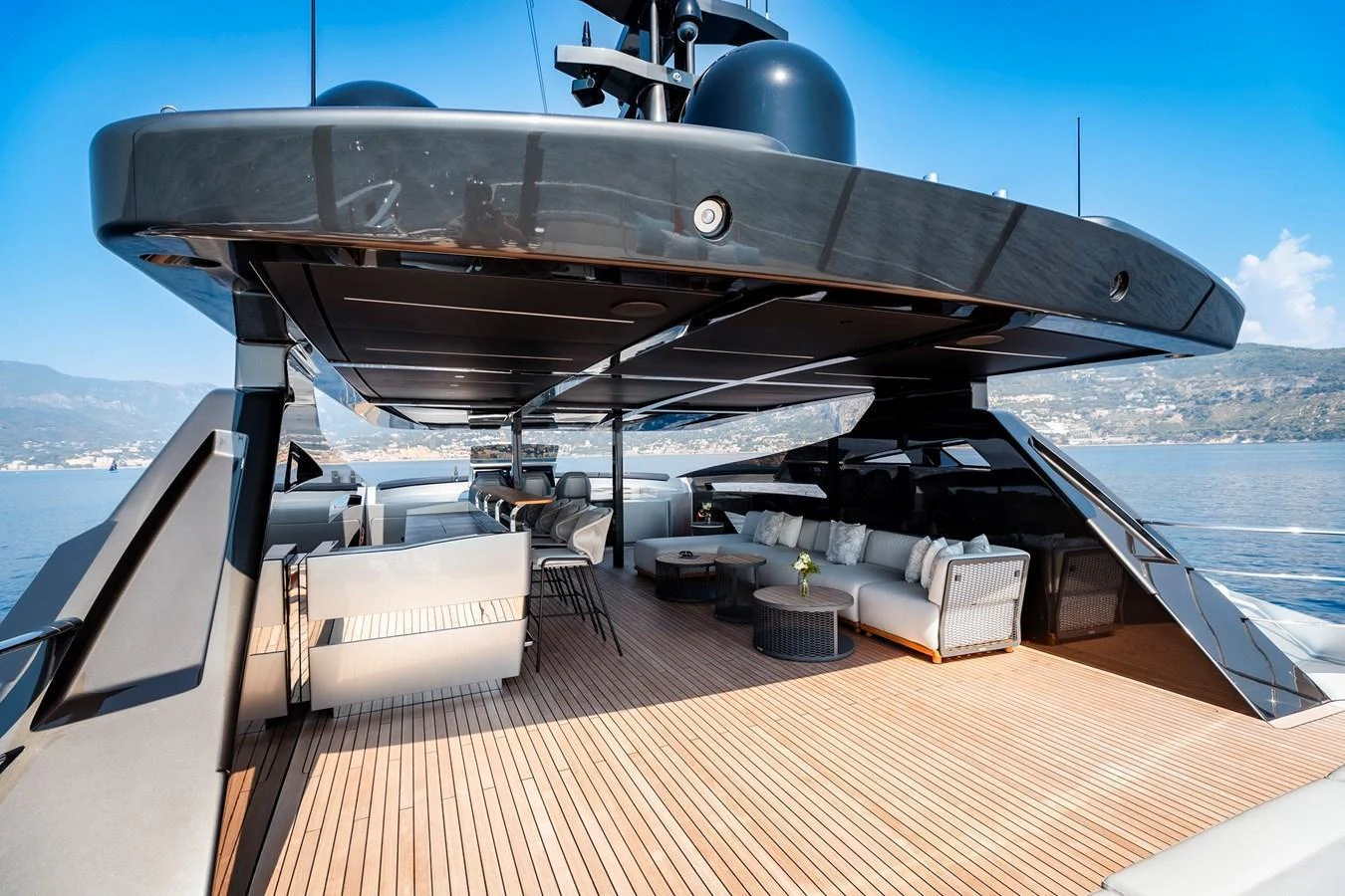 The spacious aft deck features luxurious seating and a sleek, modern design. aboard PERSHING 140 Yacht for Sale