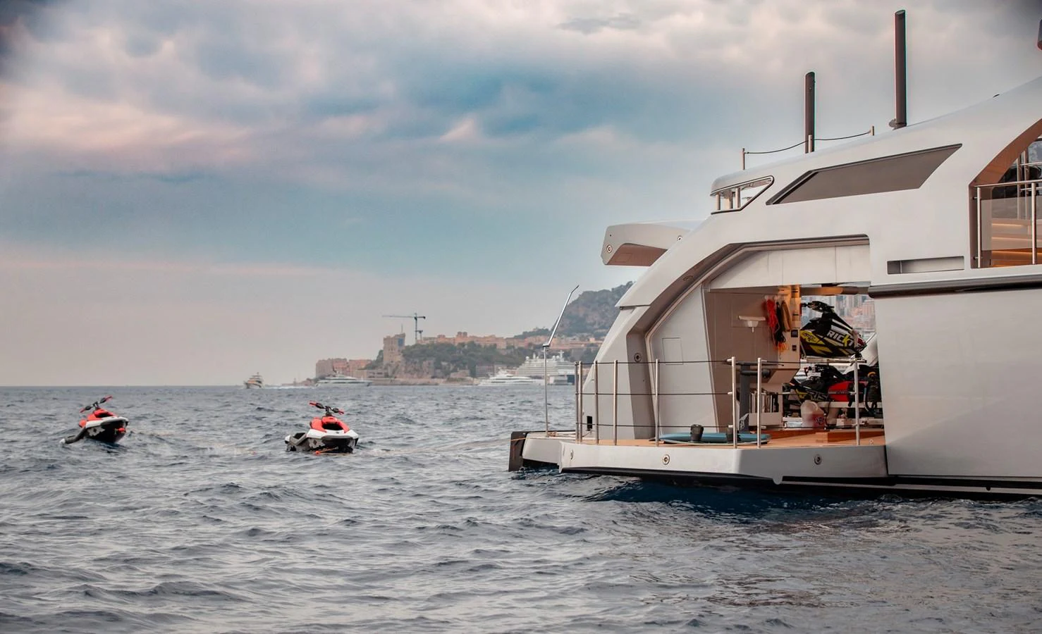 The yacht's aft deck is equipped with jet skis, ready for adventure on the open water. aboard PERSHING 140 Yacht for Sale