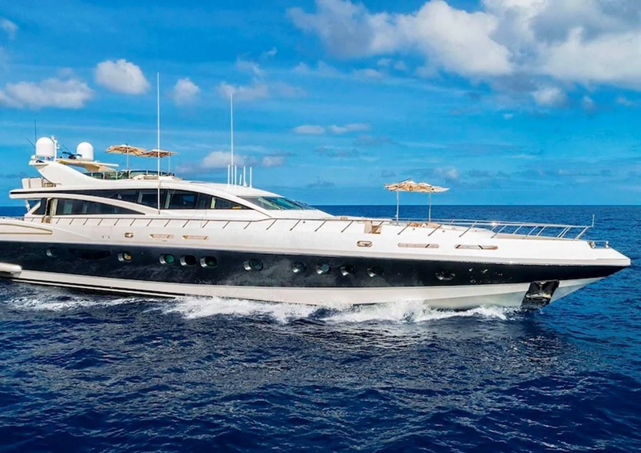 A sleek and modern yacht cruises through the open sea under a clear blue sky. aboard ANTELOPE IV Yacht for Sale