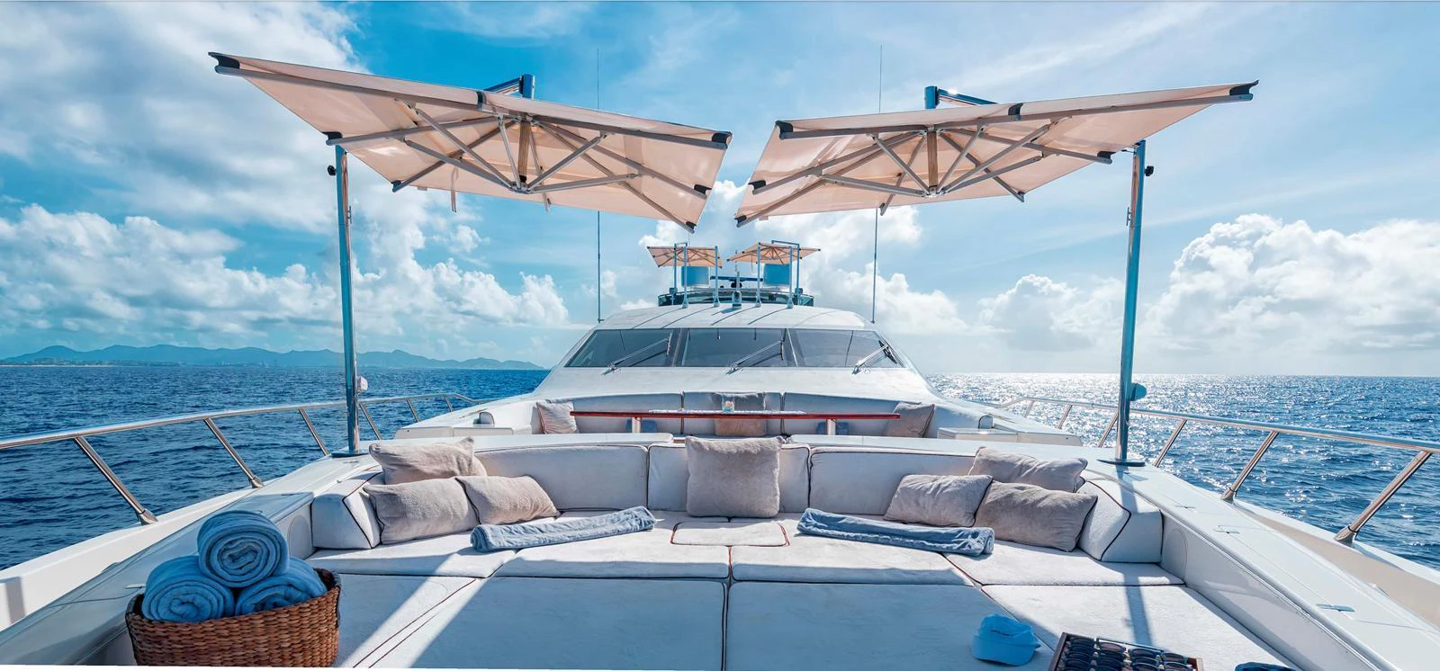The sundeck offers a luxurious lounging area with plush cushions and shade umbrellas, perfect for relaxation. aboard ANTELOPE IV Yacht for Sale