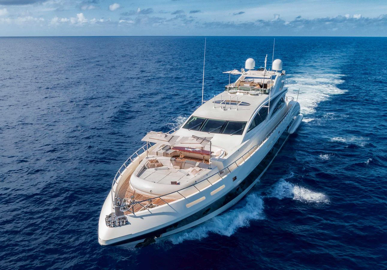 A luxurious yacht cruises through the open sea, showcasing its sleek design and spacious deck areas. aboard ANTELOPE IV Yacht for Sale