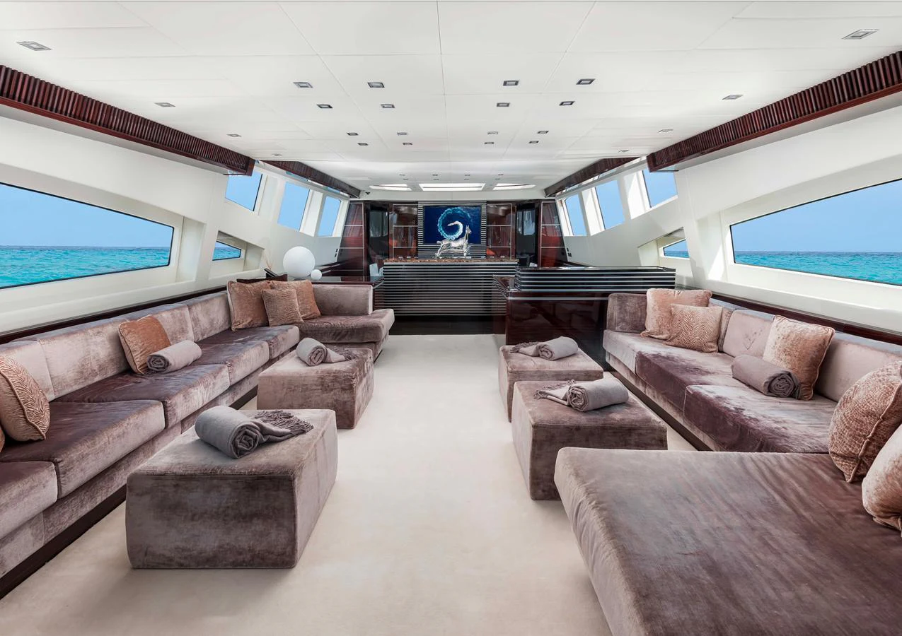 The spacious salon offers luxurious seating with panoramic ocean views. aboard ANTELOPE IV Yacht for Sale