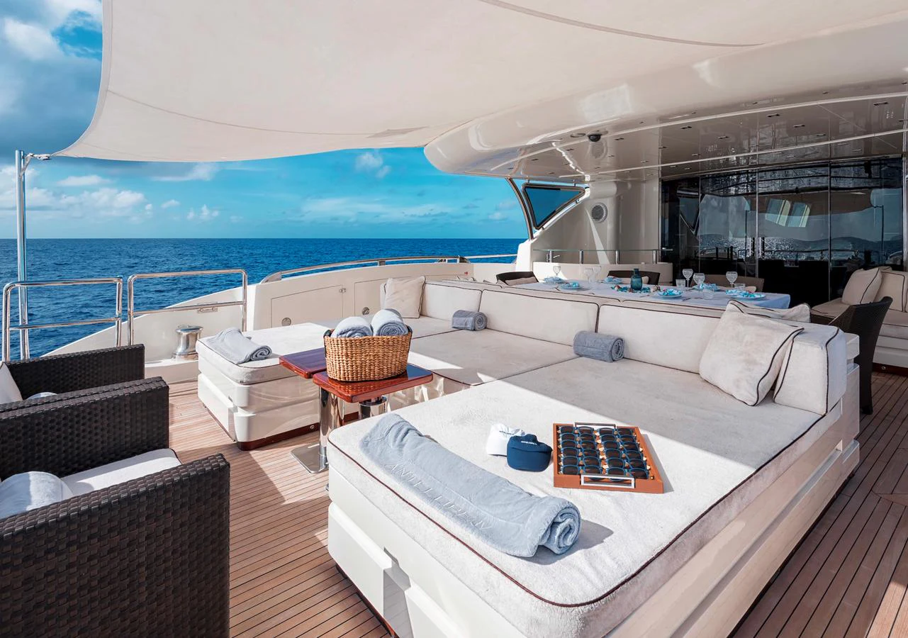 The sundeck offers a luxurious lounging area with comfortable seating and stunning ocean views. aboard ANTELOPE IV Yacht for Sale