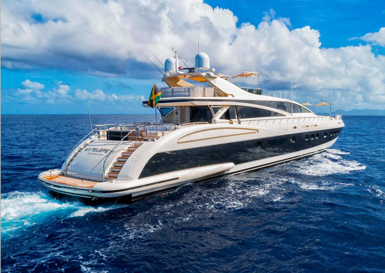A luxurious yacht cruises through the open sea under a bright blue sky. aboard ANTELOPE IV Yacht for Sale