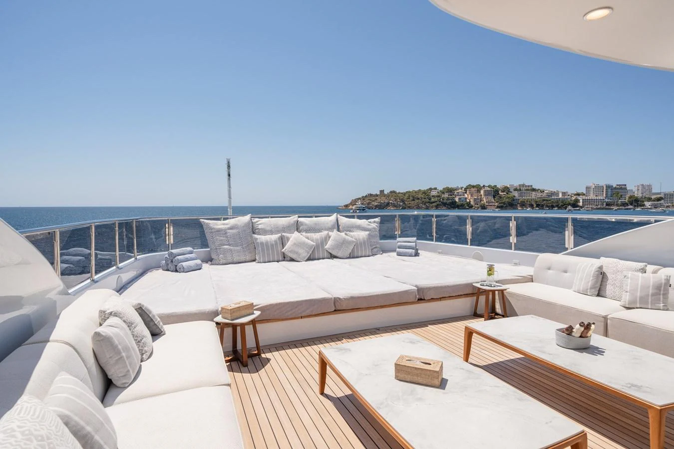 The sundeck offers a spacious and luxurious lounging area with stunning ocean views. aboard TITIAN PEARL Yacht for Sale