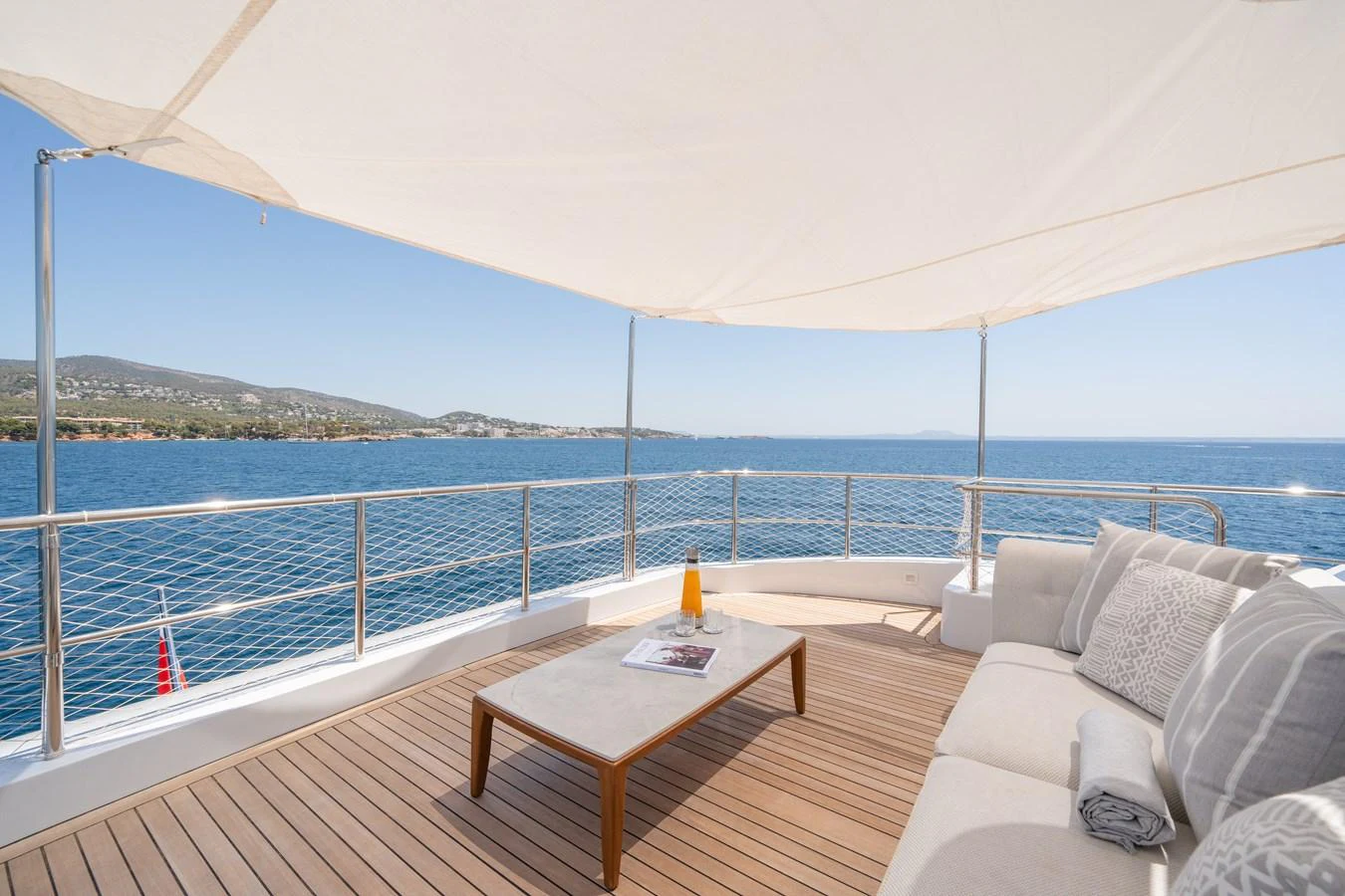The sundeck offers a serene space with comfortable seating and a stunning ocean view. aboard TITIAN PEARL Yacht for Sale