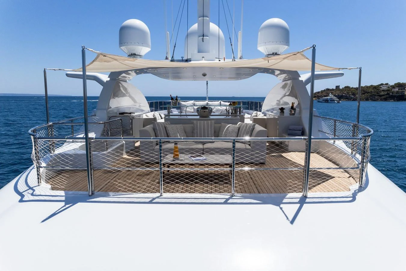 The yacht's flybridge offers a spacious and luxurious outdoor lounging area with panoramic ocean views. aboard TITIAN PEARL Yacht for Sale