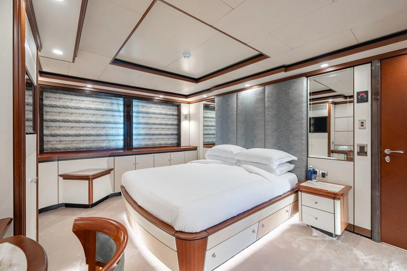 The master stateroom features a spacious bed and elegant furnishings, creating a serene and luxurious retreat. aboard TITIAN PEARL Yacht for Sale