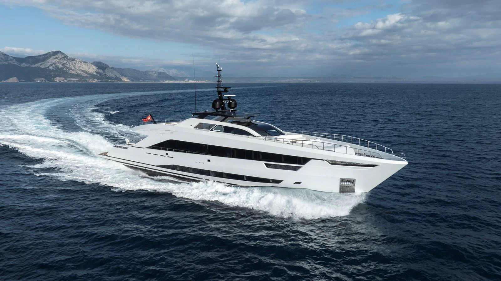 A sleek and modern yacht glides through the open sea, showcasing its elegant design and powerful performance. aboard XIMENA Yacht for Sale