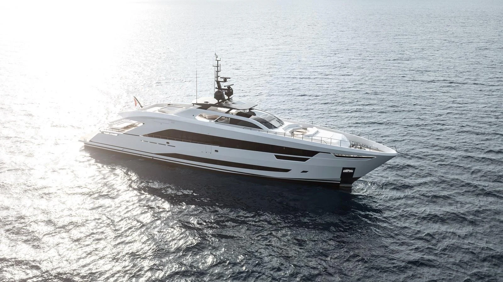 A sleek and modern yacht glides gracefully on the open water under the sun. aboard XIMENA Yacht for Sale