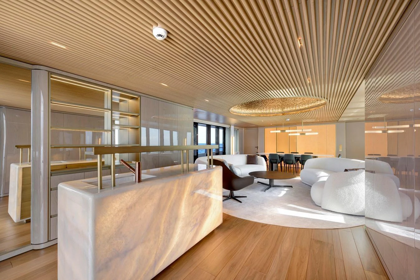 The salon features luxurious seating, elegant lighting, and a sophisticated design. aboard XIMENA Yacht for Sale