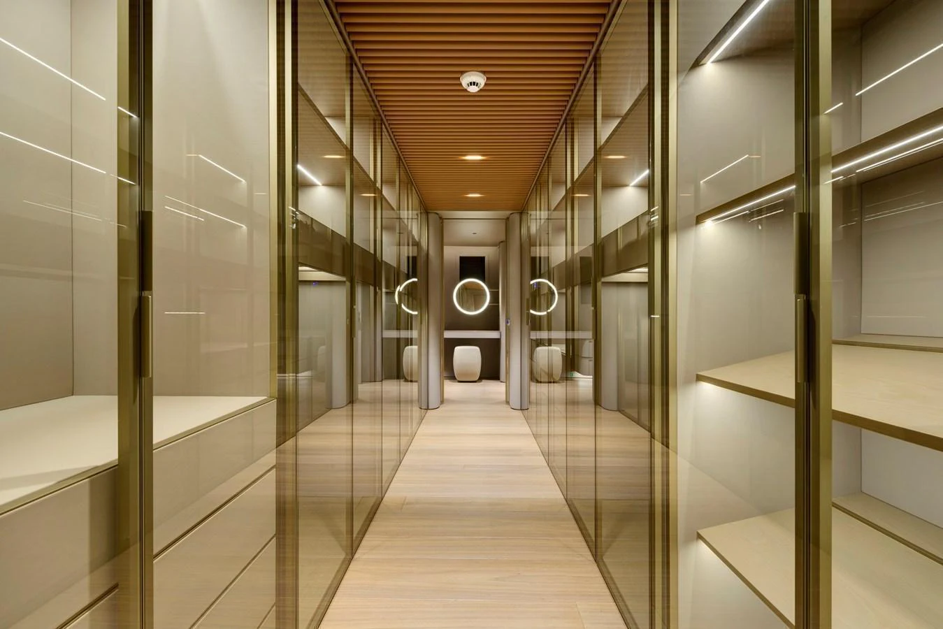 A luxurious hallway with sleek glass doors and modern lighting. aboard XIMENA Yacht for Sale