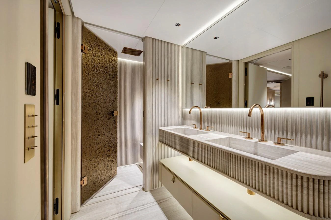 A luxurious bathroom with dual sinks and elegant fixtures. aboard XIMENA Yacht for Sale