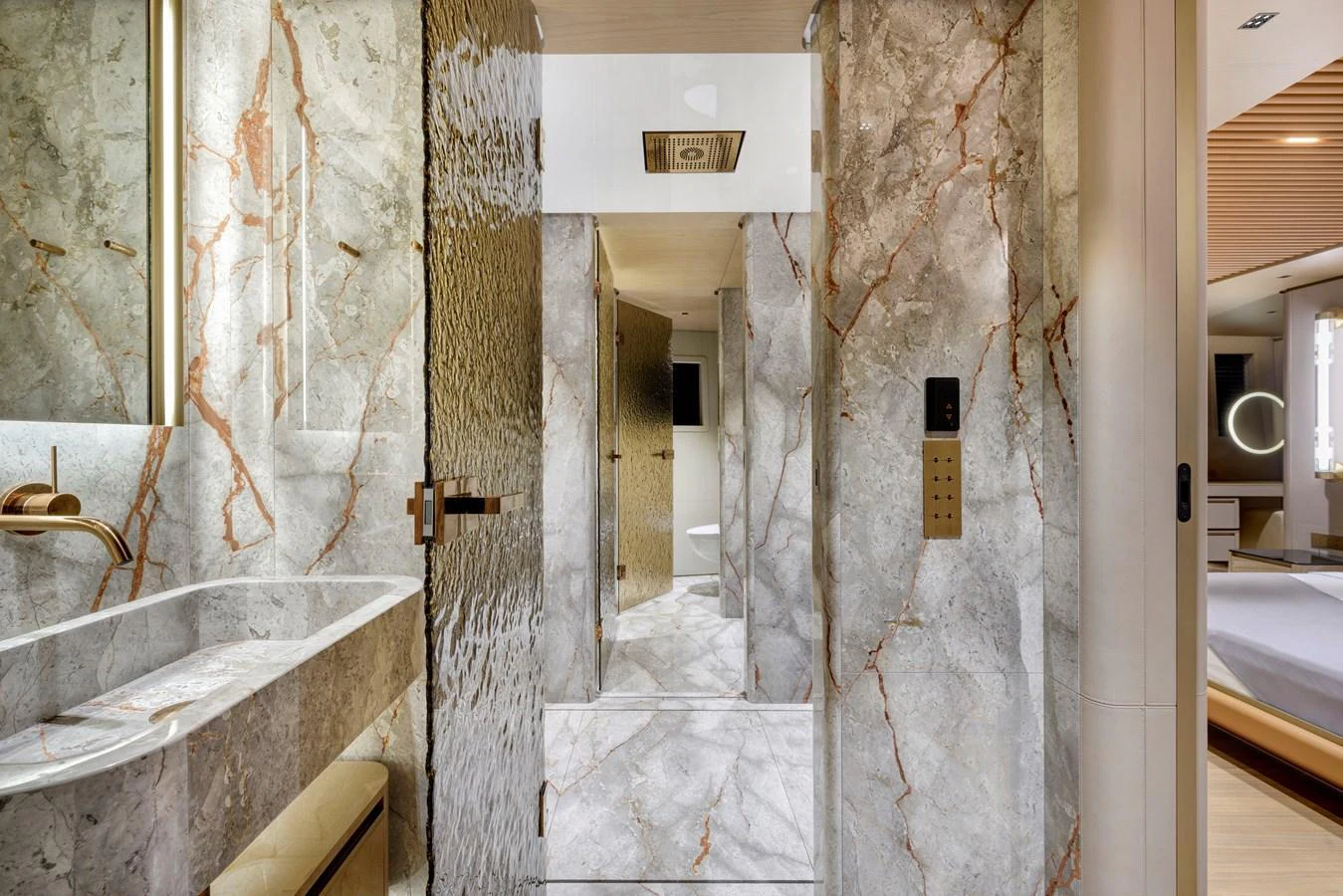 The yacht's bathroom features luxurious marble finishes and modern fixtures. aboard XIMENA Yacht for Sale