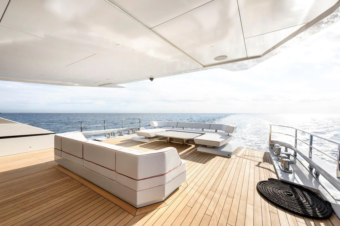 The spacious aft deck offers luxurious seating with stunning ocean views. aboard XIMENA Yacht for Sale