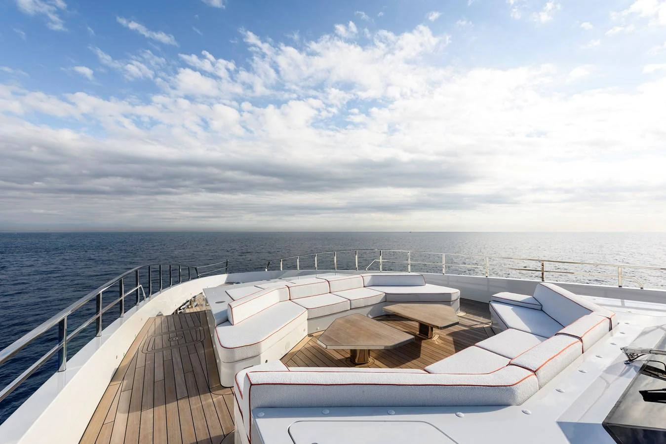 The sundeck offers a spacious and luxurious seating area with panoramic ocean views. aboard XIMENA Yacht for Sale