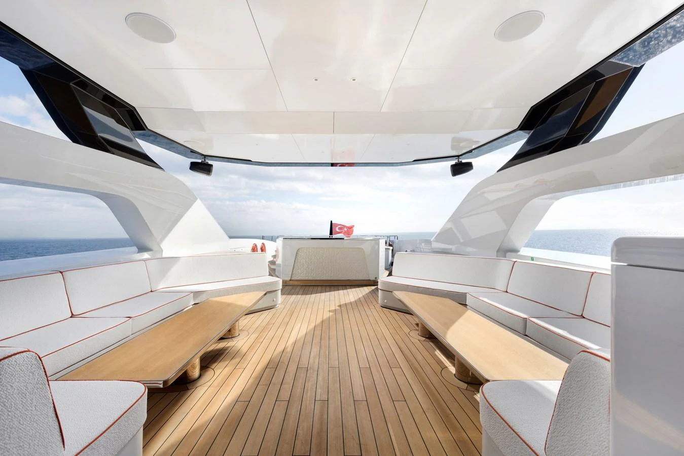 The aft deck offers a spacious and elegant seating area with a stunning view of the ocean. aboard XIMENA Yacht for Sale