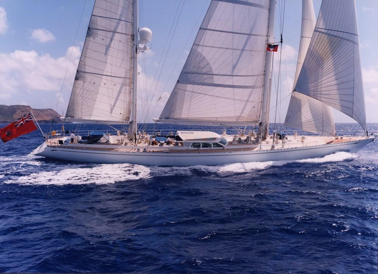 A stunning sailing yacht glides gracefully across the open sea under full sail. aboard CYCLOS III Yacht for Sale