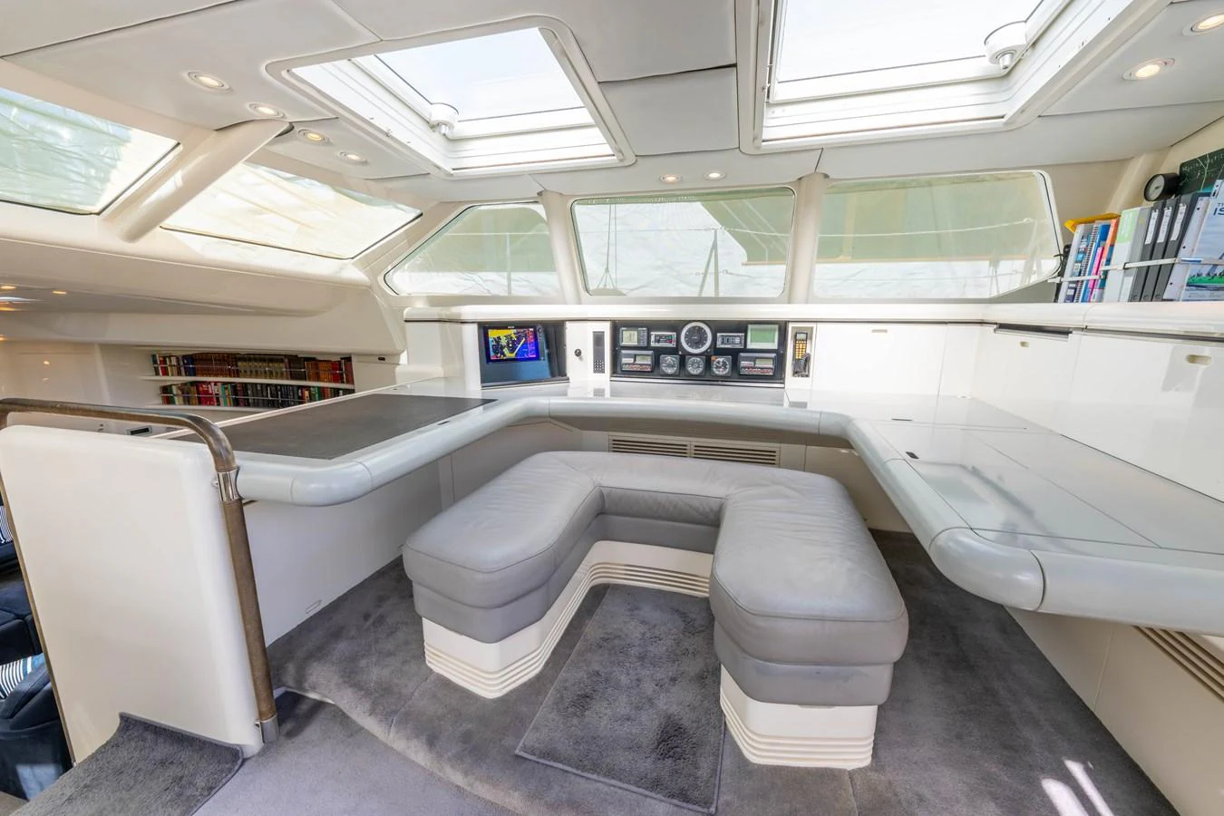 The yacht's helm features a sleek, modern design with ample seating and advanced navigation equipment. aboard CYCLOS III Yacht for Sale
