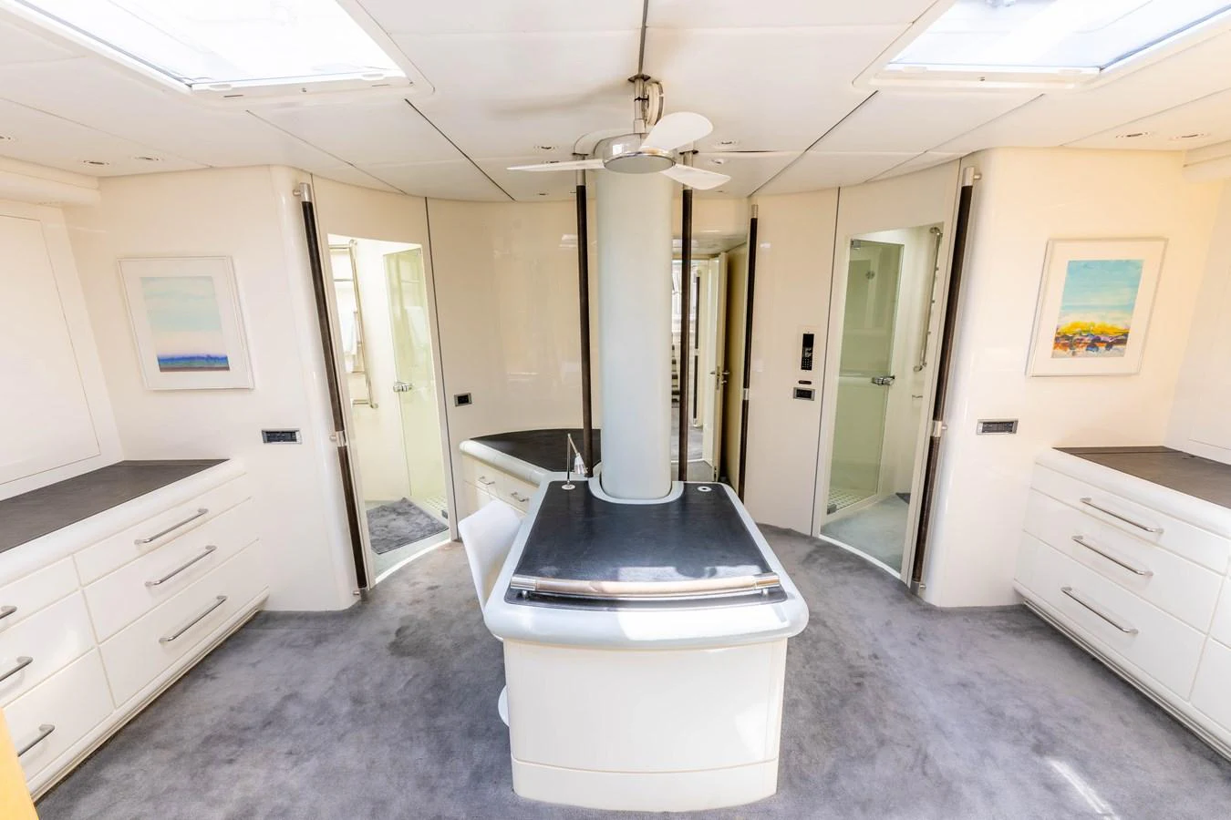 The yacht's interior features a modern, well-lit space with ample storage and sleek design. aboard CYCLOS III Yacht for Sale