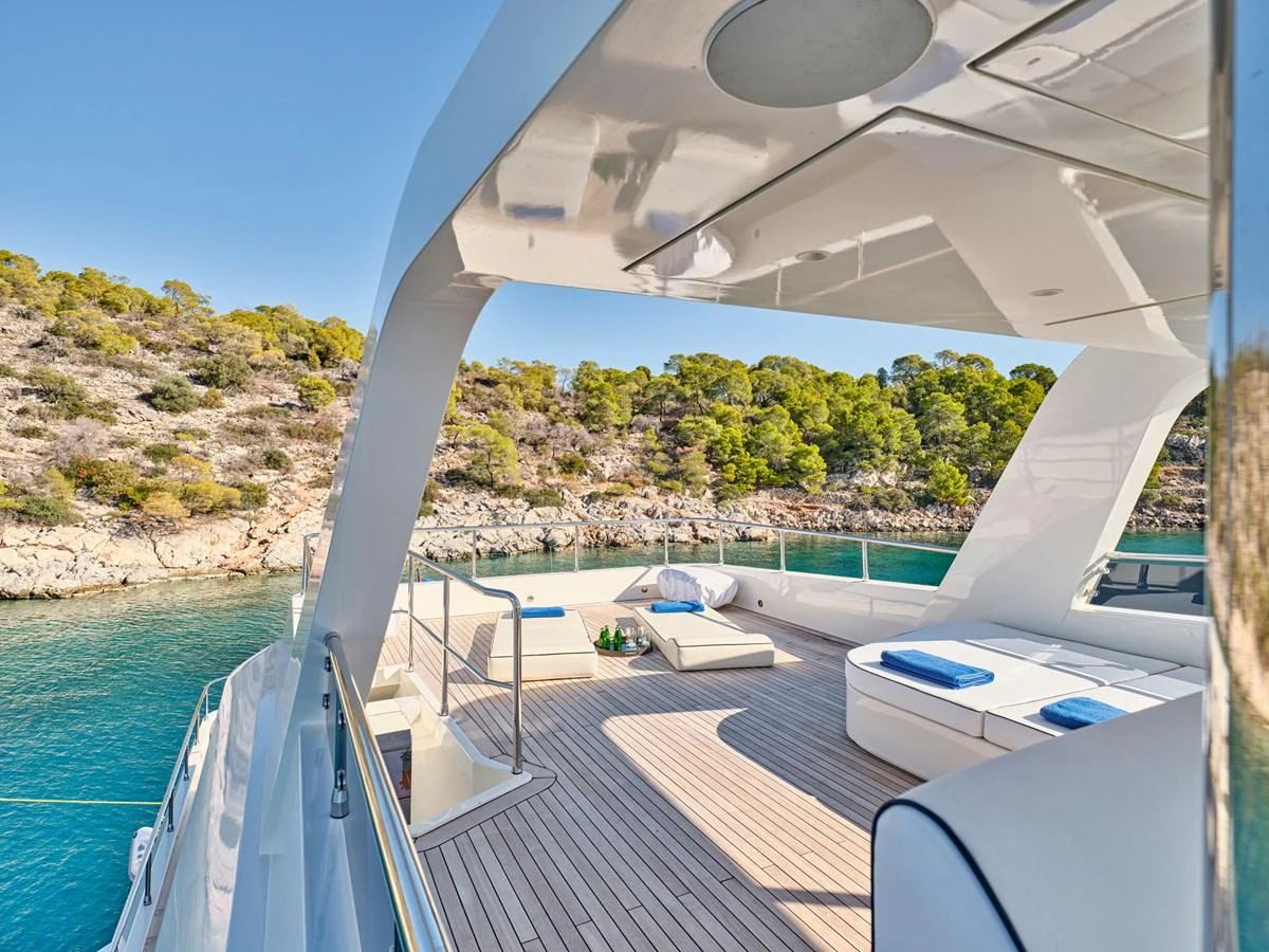 The sundeck offers a luxurious space for relaxation with scenic views of the surrounding waters. aboard CONDOR A Yacht for Sale
