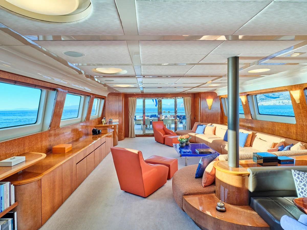 The salon offers a spacious and luxurious seating area with panoramic ocean views. aboard CONDOR A Yacht for Sale