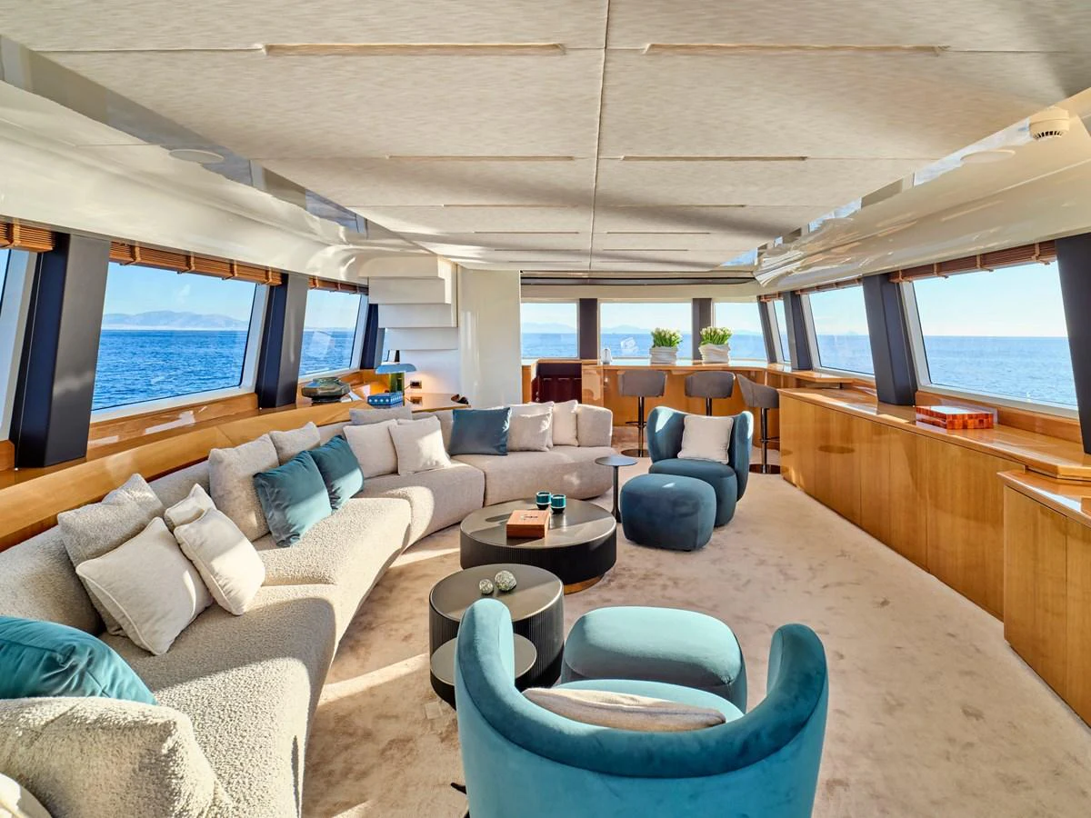 The spacious salon offers panoramic views and luxurious seating arrangements. aboard CONDOR A Yacht for Sale