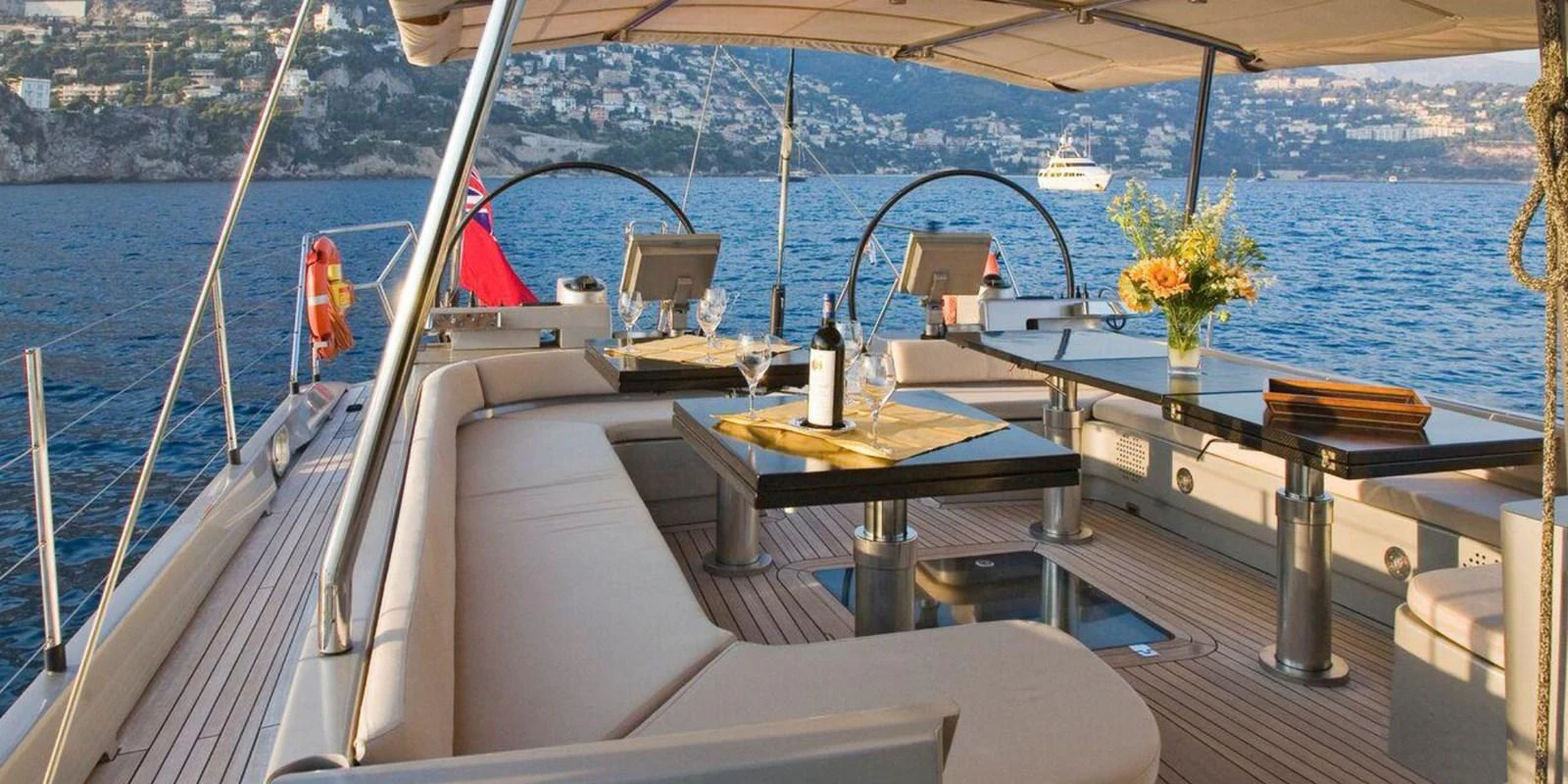 The aft deck offers a luxurious and inviting space for alfresco dining with stunning sea views. aboard YAMAKAY Yacht for Sale