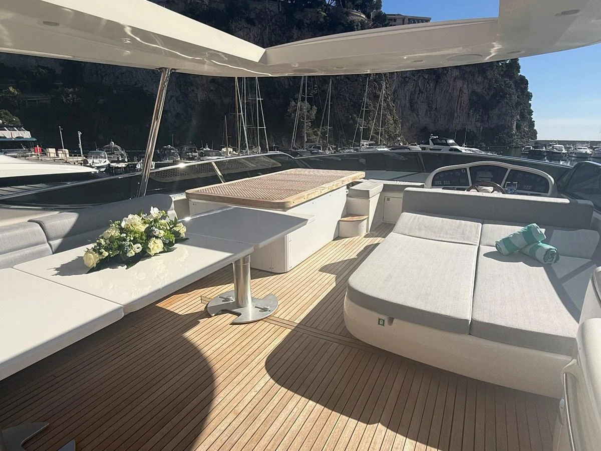The flybridge offers a spacious and elegant area for relaxation and dining with stunning views. aboard TIME OUT TOGETHER Yacht for Sale
