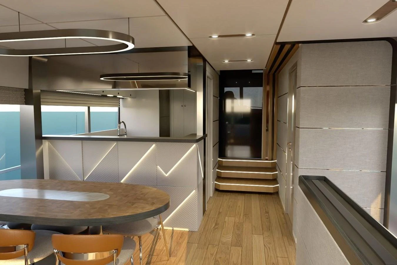 The yacht's galley features modern design with sleek cabinetry and a dining area. aboard VOYAGE 90 Yacht for Sale