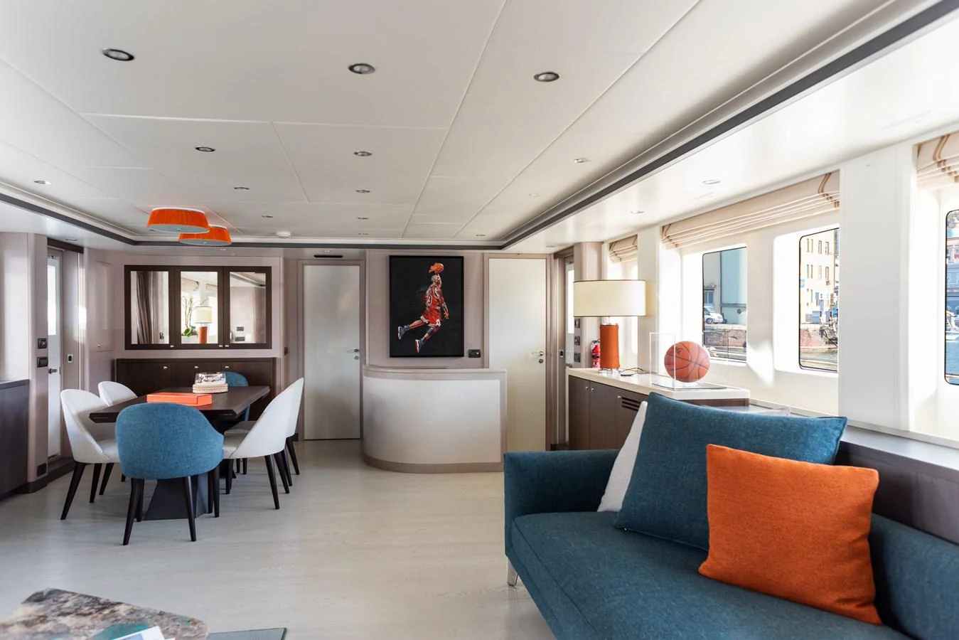 The yacht's salon features a stylish and comfortable seating area with modern decor and ample natural light. aboard GRANIL Yacht for Sale