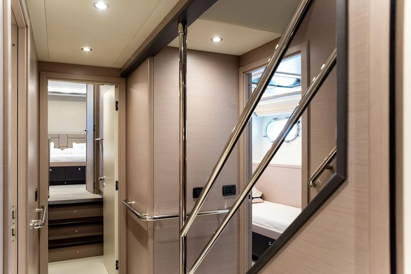 A well-lit hallway with modern finishes and access to multiple rooms. aboard GRANIL Yacht for Sale