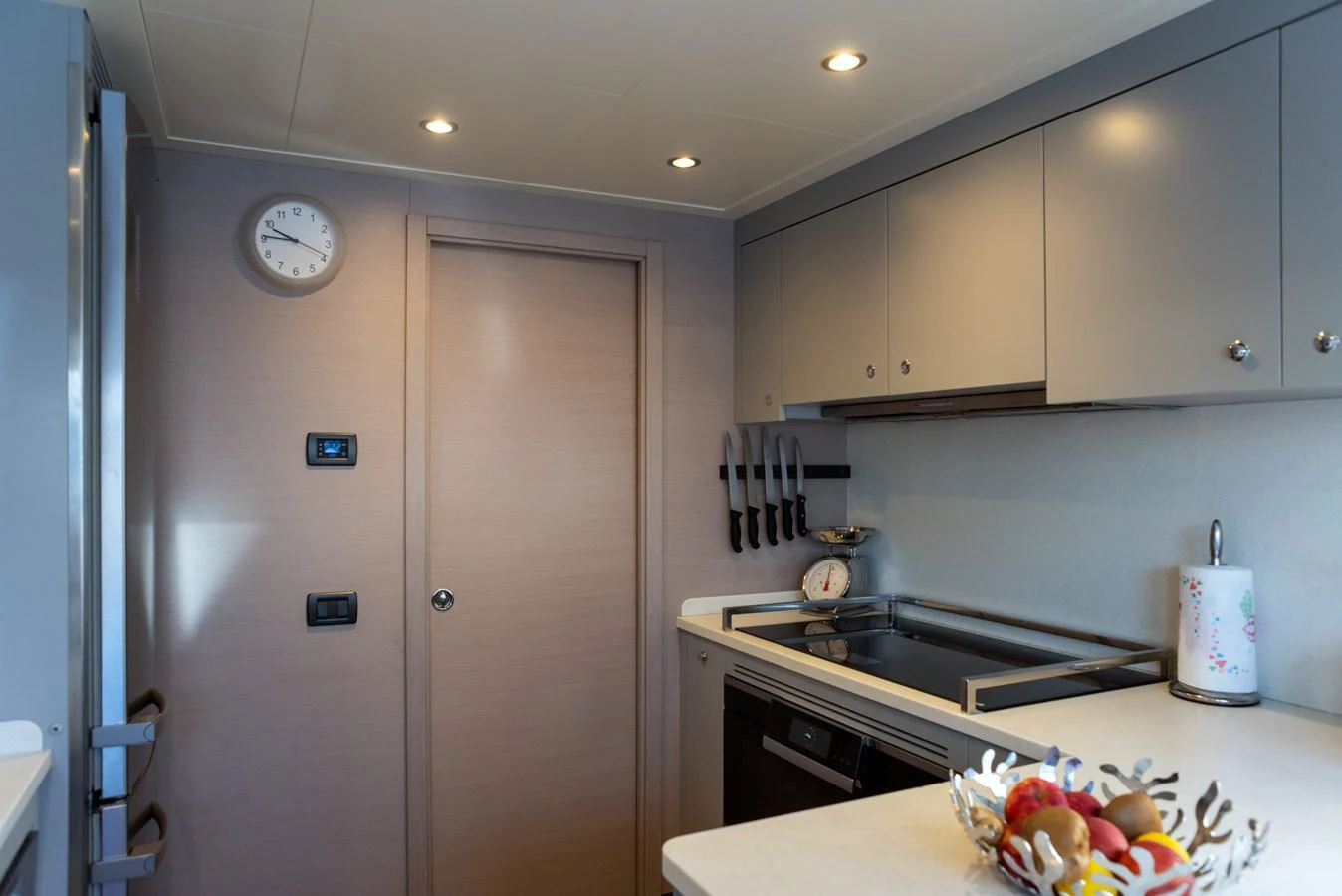 The yacht's galley is equipped with modern appliances and ample storage, creating a functional and stylish space for meal preparation. aboard GRANIL Yacht for Sale