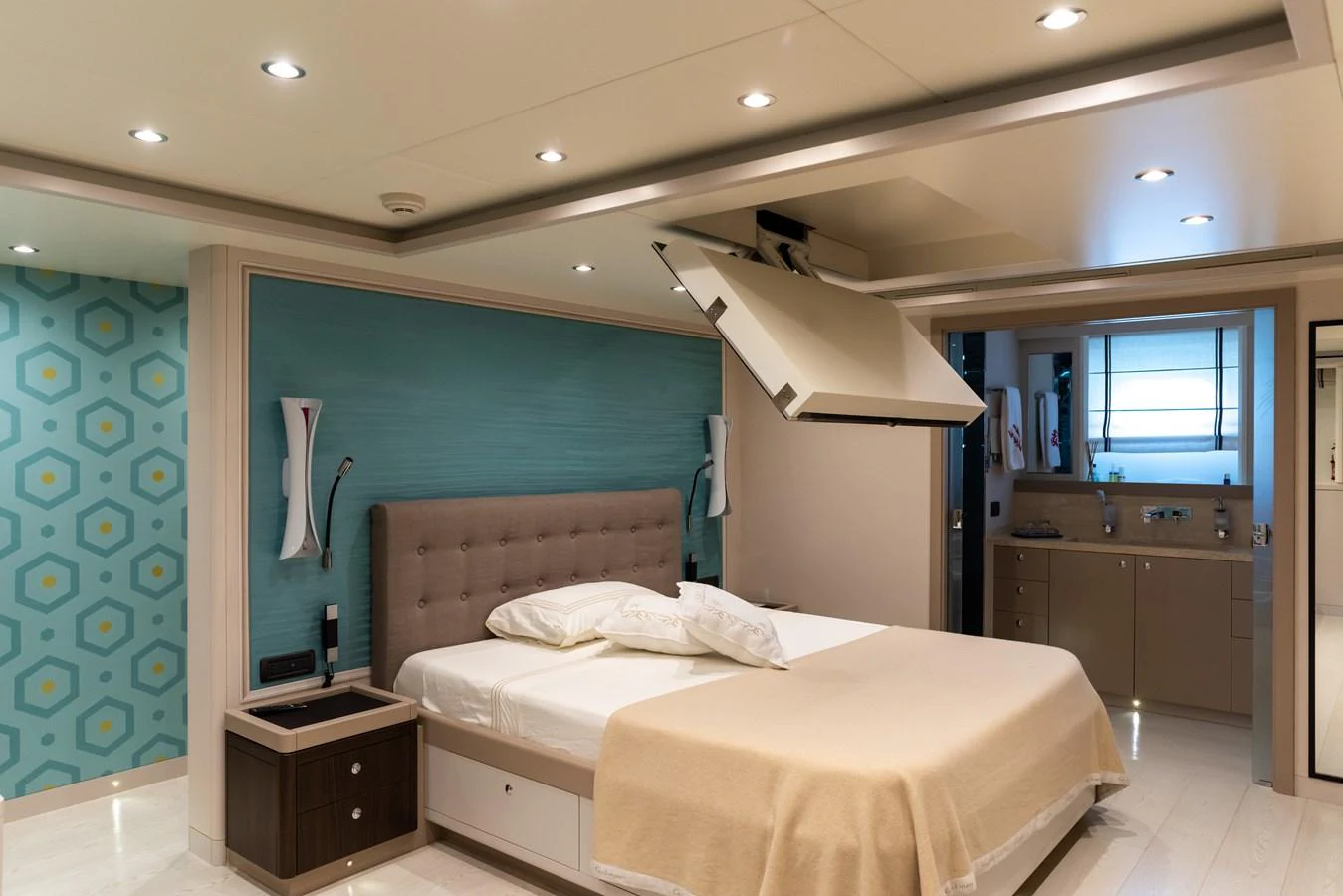 A luxurious stateroom featuring a comfortable bed and modern decor. aboard GRANIL Yacht for Sale