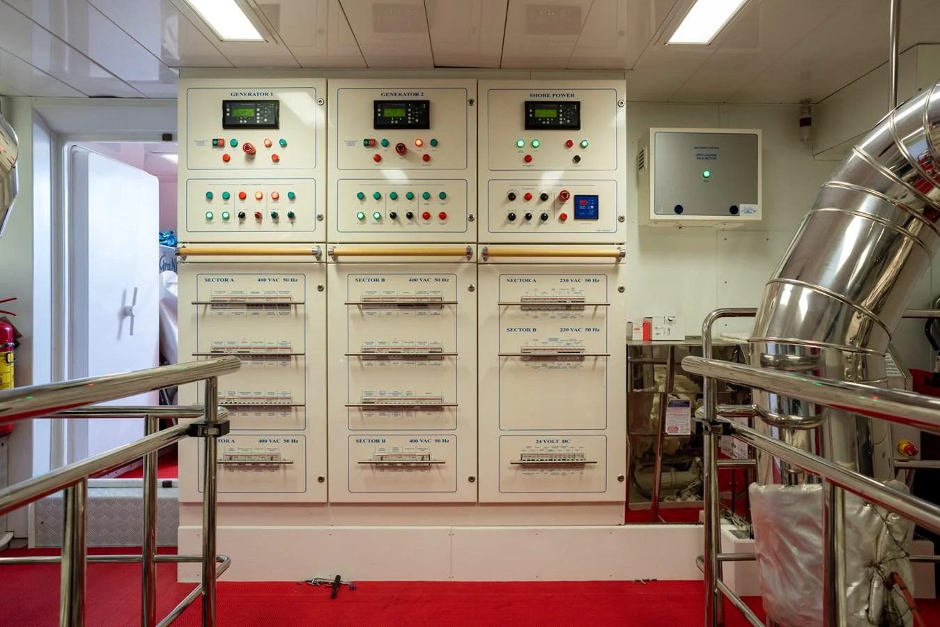 The image showcases the yacht's engine room with control panels and machinery. aboard GRANIL Yacht for Sale