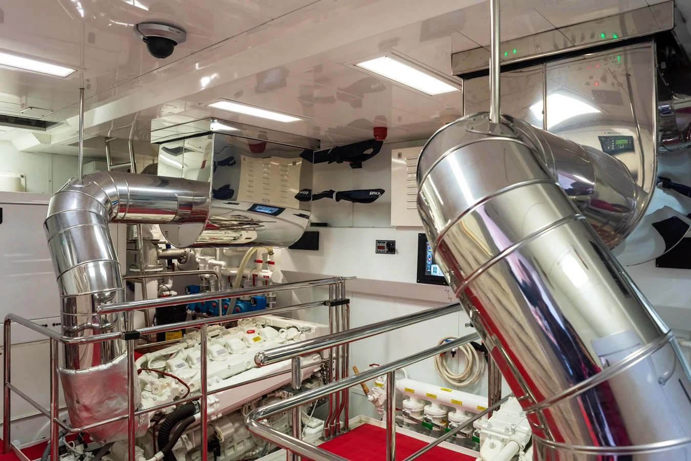 The yacht's engine room showcases advanced machinery and polished metalwork. aboard GRANIL Yacht for Sale
