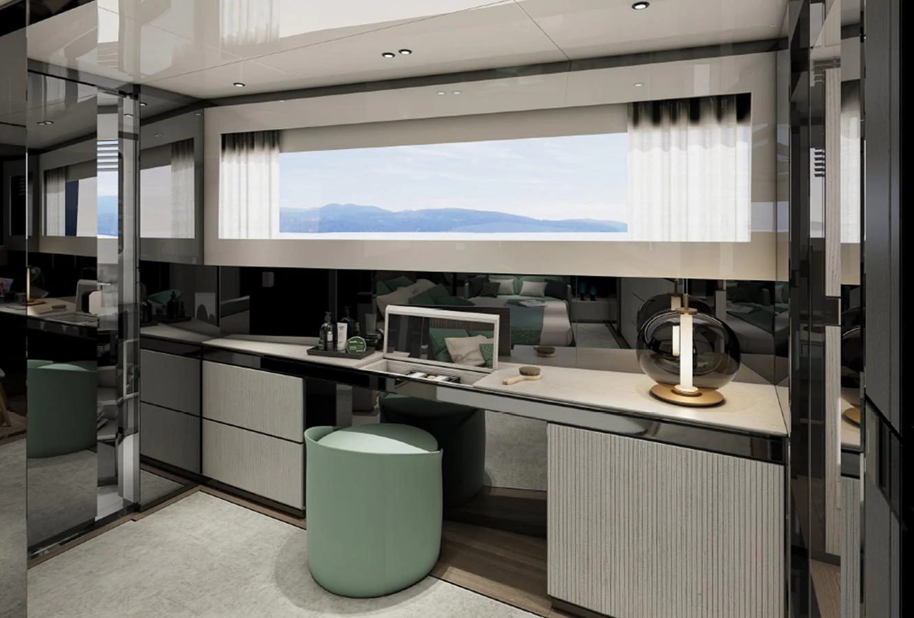 A stylish and modern interior space featuring a desk area with a scenic window view. aboard AES Yacht for Sale
