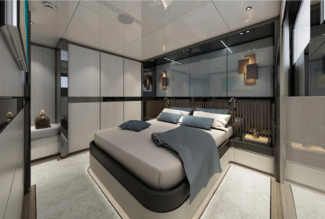 A luxurious stateroom featuring a modern design with elegant lighting and comfortable bedding. aboard AES Yacht for Sale