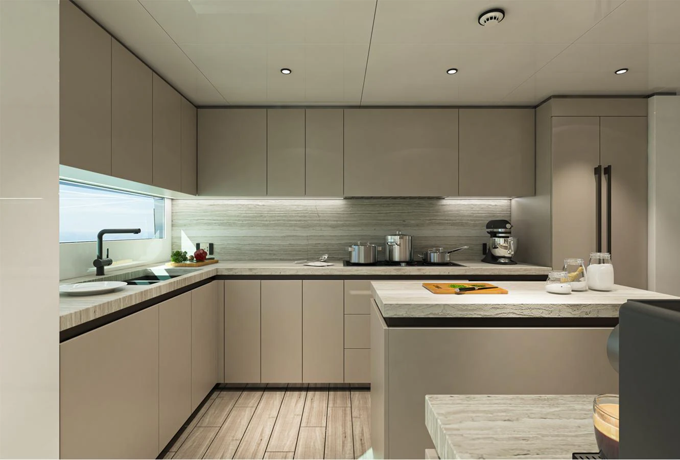 The galley features modern cabinetry, sleek countertops, and state-of-the-art appliances. aboard AES Yacht for Sale